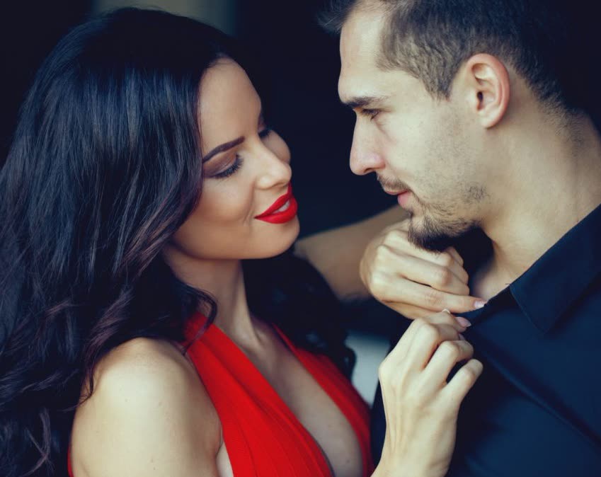 A couple sharing a close, confident moment
